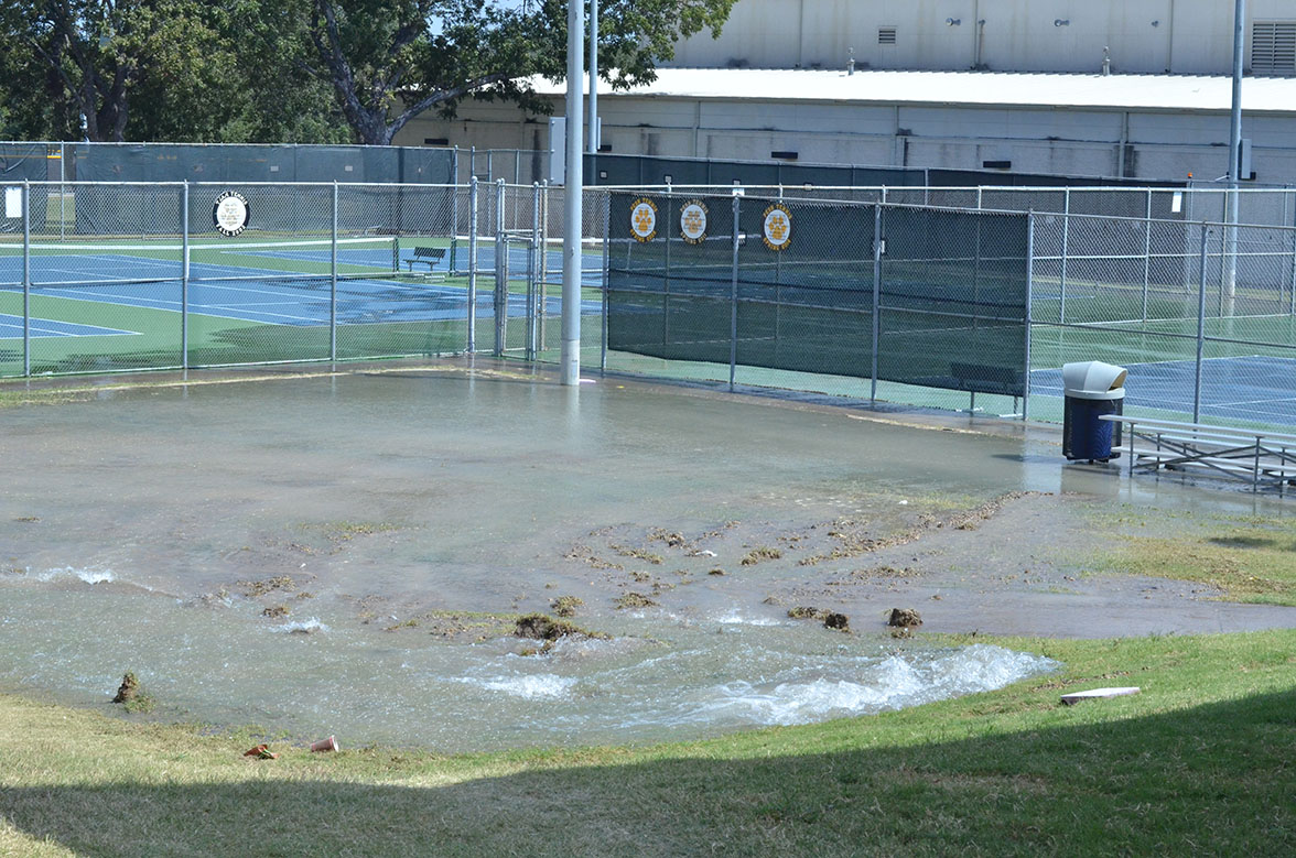 Water builds up from burst pipe.