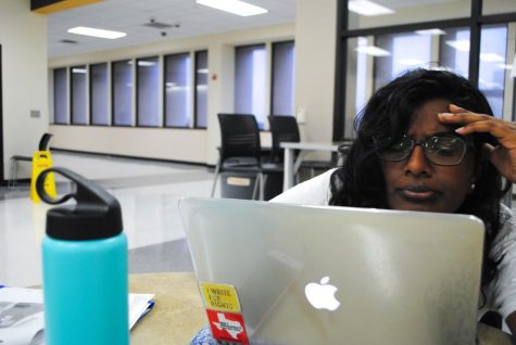 In the morning, senior Aswathi Thomas stresses over homework in the IB Commons.