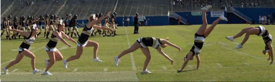 Kennedy Kerrigan (12) tumbling across the football field.