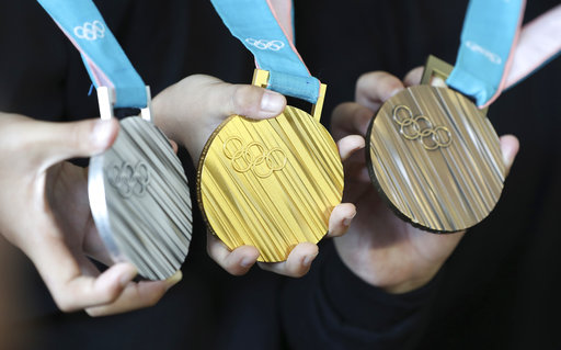 South Korean athletes with their medals during the 2018 Winter Olympics.