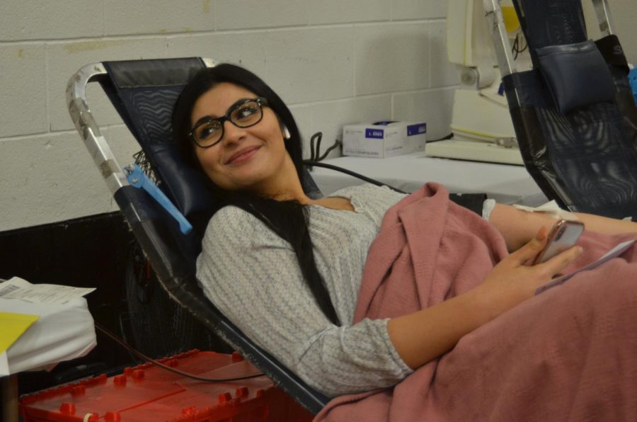 Senior Leena Rammal gives a smile after her donation.