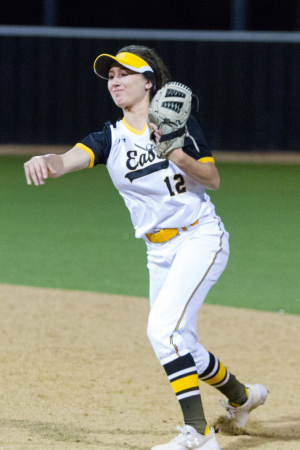 Senior Bella Konieczka makes a throw to first base.