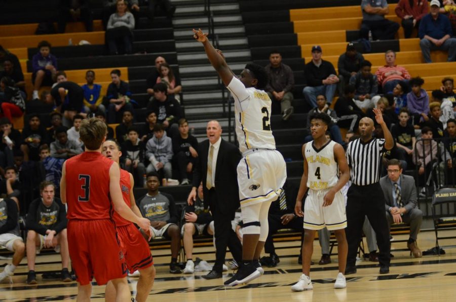 Coach Clarkson looks on as junior Jackson Davis takes the shot against McKinney Boyd on December 21, 2017.