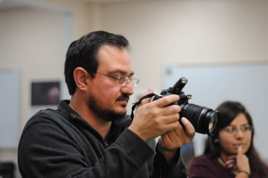 Teacher Jesus-Octavio Oropeza demonstrates taking profile shots to his digital media students.