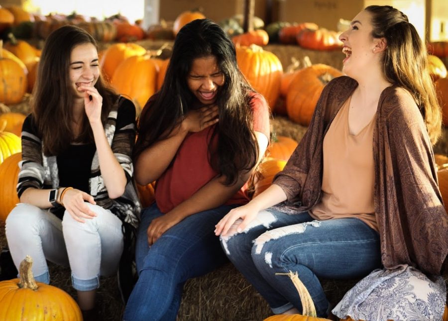 Seniors Sophia Donaghy, Evanna Momtaj and Gabrielle Collins enjoy an Autumn day at the pumpkin patch on Oct. 22, 2017.