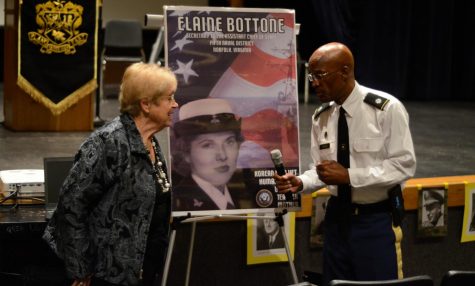 Elaine Bottone and LTC Bernard Aikens talk to each other after the presentations on Nov. 7. Elaine Bottone served in the Korean War.