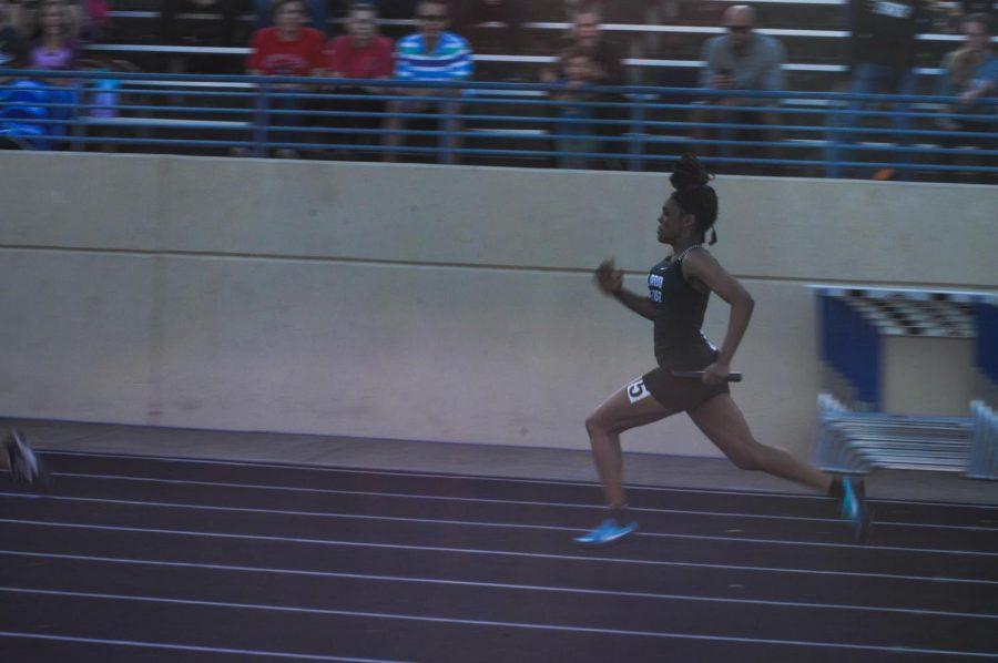 Freshman Tiana Amos races along in the 4x100 meter relay women’s junior varsity, securing second place. 