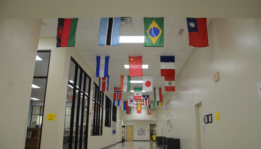 Flags line the ceiling of the Huffman Elementary lobby on April 30.