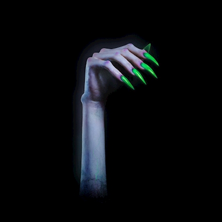 The album cover for “TURN OFF THE LIGHT” is the same zombie-like hand as the one on the “Vol. 1” EP cover, but with Petras’ nails painted green instead of purple.