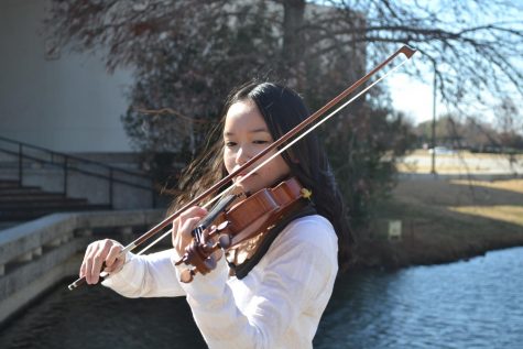 Junior Tiffany Doan practices on her violin. She is one of the four who placed in the top 3% of auditions for Texas Music Educators Association All-State.