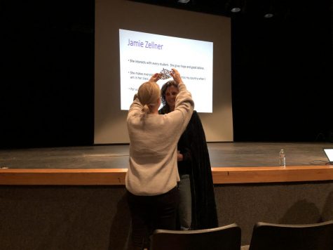 Associate Principal of Curriculum Sheela Daniels crowns ESL teacher Jamie Zellner as Teacher of the Year at a faculty meeting Dec. 10.