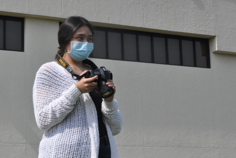 Junior Montserrat Barbosa learns how to take photos with varying angles during 3rd period, Sept. 17.