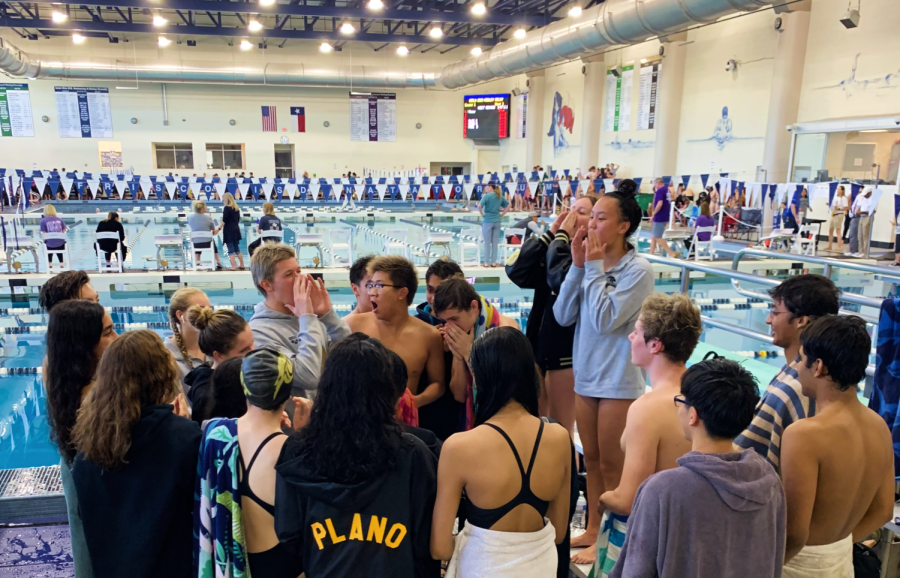 Senior captains Kendall Pinkerton, Gio Linscheer and Megan Lam lead the team cheer during the FISD TISCA Dual Meet Champs on Nov. 12.