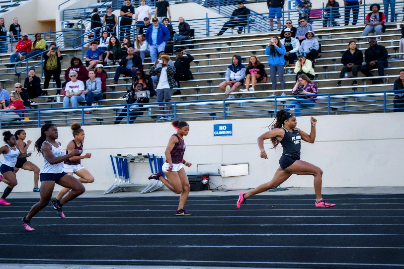 Senior Tiriah Kelley surpasses the other runners in the 100-meter dash in the district track meet at Tom Kimbrough Stadium April 13.