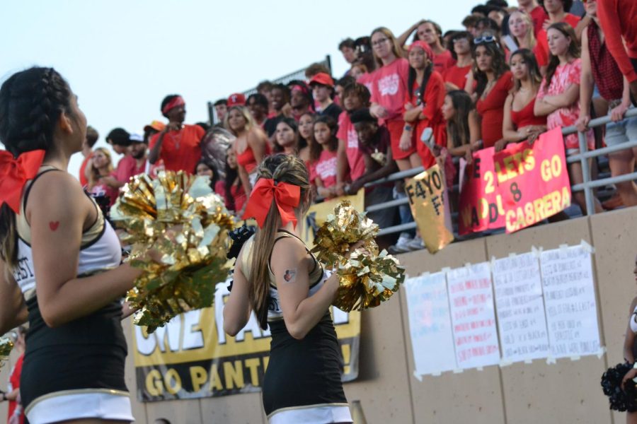 Cheerleaders amplify energy at annual red out game on Sep. 23