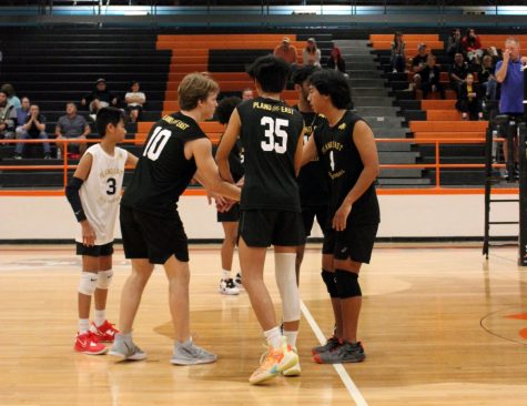 Players on the Boys Volleyball team huddle during a game in Rockwell on Feb. 16